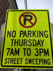 Street sweeping sign that says "No parking Thursday 7am to 3pm - Street Sweeping"